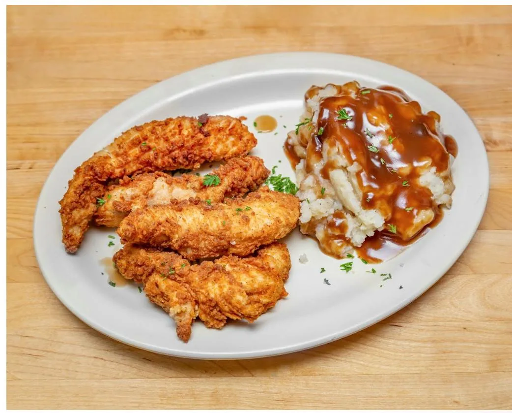 Fried chicken served with mashed potatoes and gravy