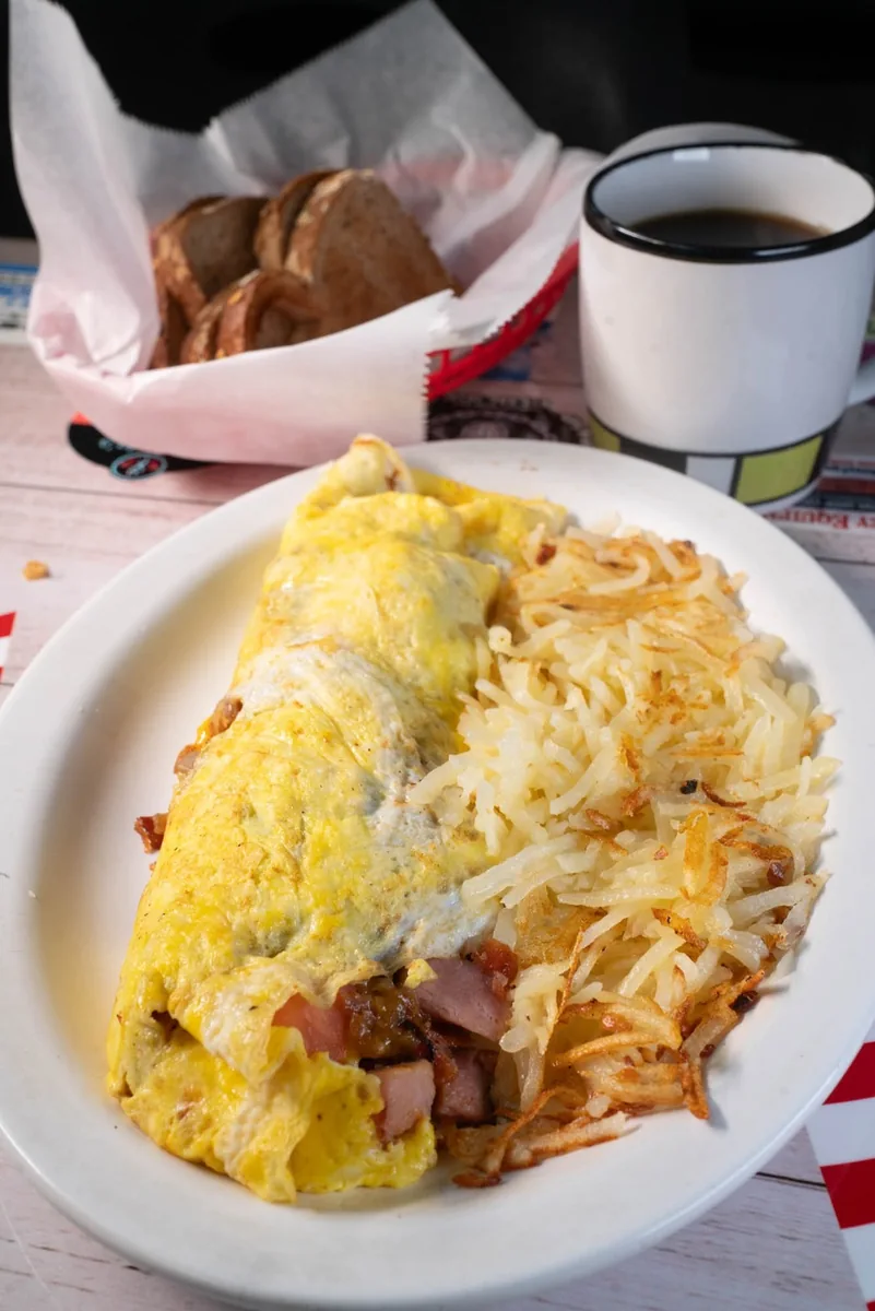 Omelette served with crispy hash browns
