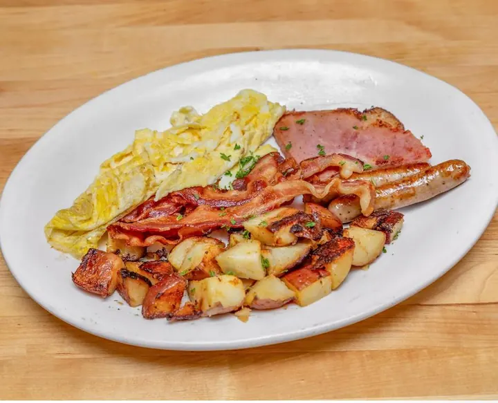Classic breakfast with eggs, bacon, sausage and home fries