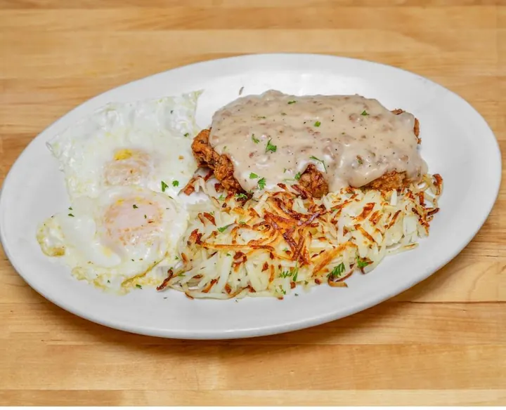 Country breakfast with eggs, hash browns and gravy